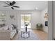 Bright living room with a ceiling fan, sliding glass door, and neutral furniture with a light gray rug at 2385 Tiffany Pl, Decatur, GA 30035