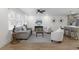 Living room with light wood floors, neutral walls, modern decor, and a ceiling fan at 2385 Tiffany Pl, Decatur, GA 30035