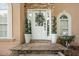 Close-up of the front door featuring stone accents and decorative plants at 274 Westchester Club Dr, Hiram, GA 30141