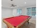 Spacious game room features tile floors, a ceiling fan, and a pool table at 274 Westchester Club Dr, Hiram, GA 30141