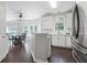 Well-lit kitchen with a dining area and stainless steel refrigerator, combining functionality with style at 274 Westchester Club Dr, Hiram, GA 30141