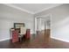 Office space with dark wood floors next to an entryway featuring stately white columns and dark wood floors at 274 Westchester Club Dr, Hiram, GA 30141