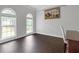 Empty office featuring natural light from arched windows and dark wood floors, awaiting your personal touch at 274 Westchester Club Dr, Hiram, GA 30141