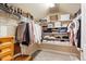 Organized walk-in closet featuring built-in shelving and ample space for storage and organization at 3830 Deer Run Dr, Cumming, GA 30028