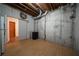 Unfinished basement area with exposed beams and concrete walls, ready for customization at 1165 Pin Oak Ct, Cumming, GA 30041