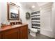 Full bathroom with a wooden vanity, gray tile, and a tub shower combo at 1165 Pin Oak Ct, Cumming, GA 30041