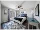 Neutral bedroom with ceiling fan, decor, and window allowing plenty of light at 1165 Pin Oak Ct, Cumming, GA 30041