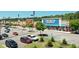 Commercial area featuring multiple stores, ample parking, and well-manicured landscaping for curb appeal at 1165 Pin Oak Ct, Cumming, GA 30041