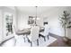 Formal dining room with natural light, a decorative chandelier, and seating for six at 1165 Pin Oak Ct, Cumming, GA 30041