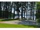 Scenic campsite with picnic table under tall trees offering views of the lake at 1165 Pin Oak Ct, Cumming, GA 30041