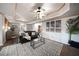 Finished basement living room with coffered ceiling, fireplace and ample seating at 1165 Pin Oak Ct, Cumming, GA 30041