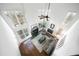 Aerial view showcasing the bright living room with soaring ceilings and a seamless flow into the kitchen at 1165 Pin Oak Ct, Cumming, GA 30041