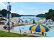 Vibrant water park with colorful umbrellas, slides, and beachfront views, ideal for Gathering fun at 1165 Pin Oak Ct, Cumming, GA 30041