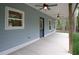 Covered porch with ceiling fans, recessed lighting, and stained wood support columns at 2117 Hwy 101 N, Dallas, GA 30157