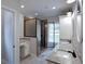Stylish bathroom with dual vanities, granite countertops, and modern glass shower at 2117 Hwy 101 N, Dallas, GA 30157