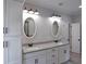 Elegant bathroom with dual sinks, granite countertops, and decorative lighting at 2117 Hwy 101 N, Dallas, GA 30157
