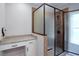 Luxurious bathroom features a vanity area and modern glass-enclosed shower with decorative tile at 2117 Hwy 101 N, Dallas, GA 30157