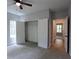 Bedroom featuring a double-door closet and easy access to the hallway with light-colored walls and neutral carpet at 2117 Hwy 101 N, Dallas, GA 30157