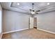 Inviting bedroom features carpet flooring, a ceiling fan, and ensuite bathroom at 2117 Hwy 101 N, Dallas, GA 30157