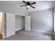Bedroom featuring a double-door closet and easy access to the hallway with light-colored walls and neutral carpet at 2117 Hwy 101 N, Dallas, GA 30157