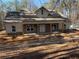 Charming new two-story home featuring a welcoming front porch with stone accents and light-colored siding at 2117 Hwy 101 N, Dallas, GA 30157