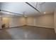 A spacious three car garage with epoxy flooring and a door leading to the home's interior at 2117 Hwy 101 N, Dallas, GA 30157