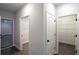Hallway with walk-in closets featuring custom shelving for optimal storage solutions at 2117 Hwy 101 N, Dallas, GA 30157