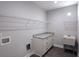 Functional laundry room with granite countertop, sink, cabinets, and shelving at 2117 Hwy 101 N, Dallas, GA 30157