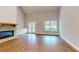 Bright living room featuring hardwood floors, a modern fireplace, and large windows at 2117 Hwy 101 N, Dallas, GA 30157
