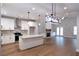 Open-concept design featuring hardwood floors, a kitchen with white cabinets, and ample natural light at 2117 Hwy 101 N, Dallas, GA 30157