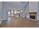Open-concept design featuring hardwood floors, a kitchen with white cabinets, and ample natural light at 2117 Hwy 101 N, Dallas, GA 30157