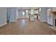 Open-concept design featuring hardwood floors, a kitchen with white cabinets, and ample natural light at 2117 Hwy 101 N, Dallas, GA 30157