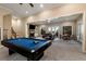 Finished basement area with a pool table, fireplace, and comfortable seating at 3330 Chimney Point Dr, Cumming, GA 30041