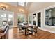 Sunlit dining area with hardwood floors and views of the outdoor space, offering a cozy atmosphere at 3330 Chimney Point Dr, Cumming, GA 30041