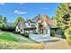 Beautiful two-story home featuring a stone facade, attached garage, and a well-manicured lawn at 3330 Chimney Point Dr, Cumming, GA 30041