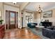 Inviting foyer with hardwood flooring, a decorative front door, and a view of the stylishly furnished living room at 3330 Chimney Point Dr, Cumming, GA 30041