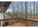 A charming wood deck overlooking a treed backyard offers a relaxing outdoor retreat at 365 Cowan Rd, Covington, GA 30016