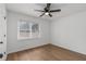 Bright bedroom features hardwood floors, ceiling fan, window with blinds, and a closet at 365 Cowan Rd, Covington, GA 30016