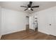 Cozy bedroom featuring a ceiling fan, neutral paint, hardwood flooring, and a closet at 365 Cowan Rd, Covington, GA 30016