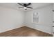 Comfortable bedroom featuring a modern ceiling fan, window, and hardwood flooring at 365 Cowan Rd, Covington, GA 30016