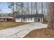 Charming one-story home featuring an extra long driveway and a covered carport at 365 Cowan Rd, Covington, GA 30016