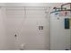 Utility room with shelving, hookups, and a water heater at 365 Cowan Rd, Covington, GA 30016