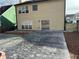 Backyard featuring a textured concrete patio, lawn, and exterior view of the home at 430 Citronelle Dr, Woodstock, GA 30188