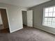 Bedroom with light grey walls and view into the closet at 430 Citronelle Dr, Woodstock, GA 30188