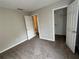 Bedroom with neutral carpet and two closets at 430 Citronelle Dr, Woodstock, GA 30188