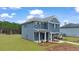 Inviting two-story home with a blue exterior, a well-manicured front yard, and a covered entry at 125 Maplewood Ln, Conyers, GA 30094