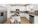Modern kitchen featuring white cabinetry, stainless steel appliances, granite counters, and center island with barstool seating at 125 Maplewood Ln, Conyers, GA 30094