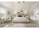 Bright main bedroom featuring vaulted ceilings, plush carpet, a neutral palette, and decorative furnishings at 125 Maplewood Ln, Conyers, GA 30094
