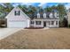 Charming single-Gathering home with a well-manicured lawn, two-car garage, and inviting front porch at 2229 Saint Kennedy Ln, Buford, GA 30518