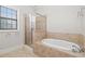 Bathroom featuring soaking tub and a tiled shower at 2300 Peachford Rd # 3411, Atlanta, GA 30338